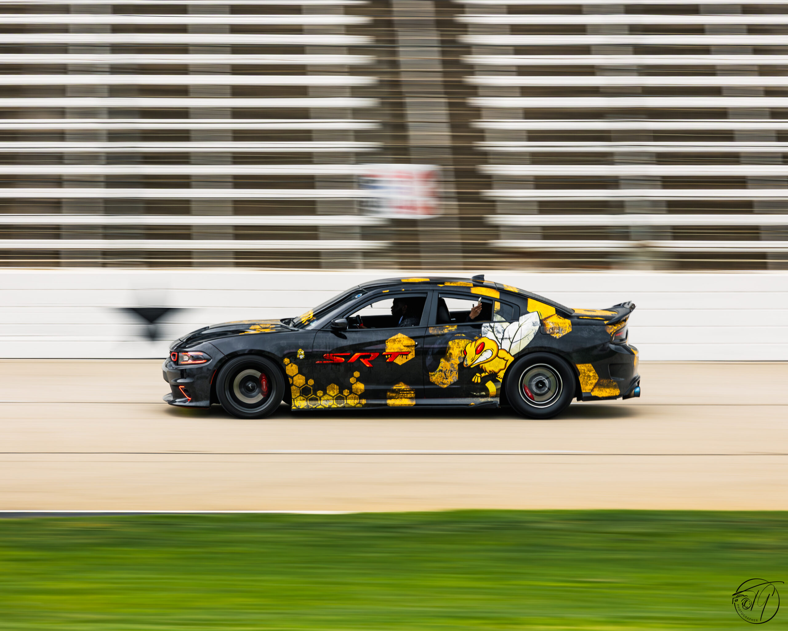Camo-wrapped car drifting on the track